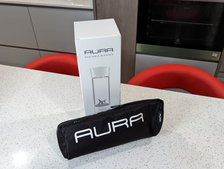 Aura Blender Review: Sip Your Way to Health with Smoothies* 1 a white table with a black bag on top of it
