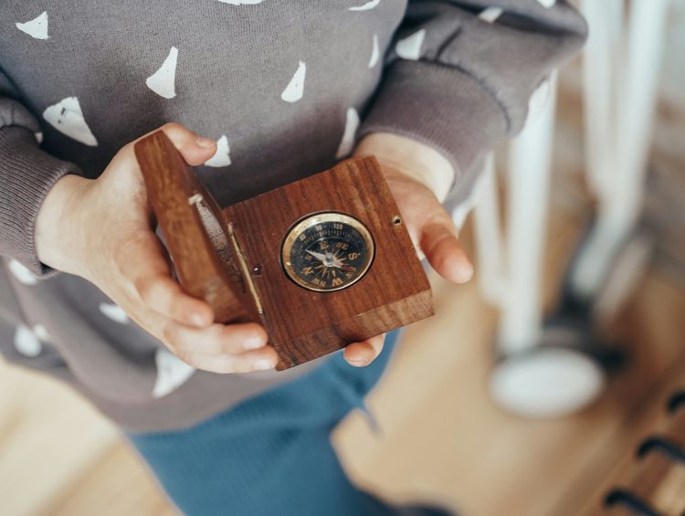 Deer Placenta: What is the Benefit of Consuming* 1 a person holding a wooden clock in their hands