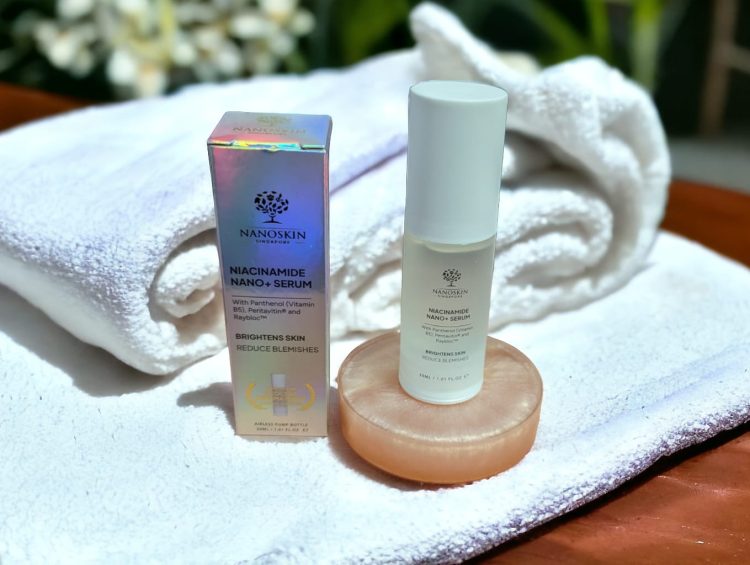 Niacinamide Serum: How to Reduce Blemishes and Fine Lines* 1 a bottle of Niacinamide Serum sitting on top of a white towel