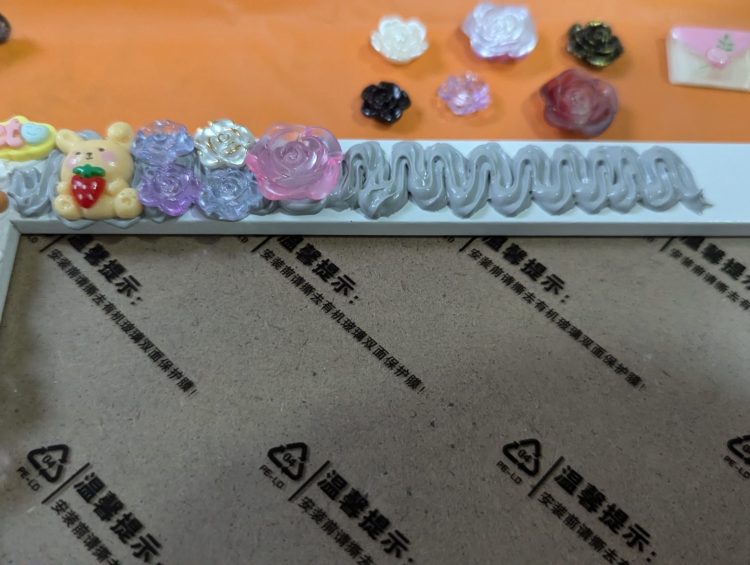 a picture frame with a bunch of buttons on it