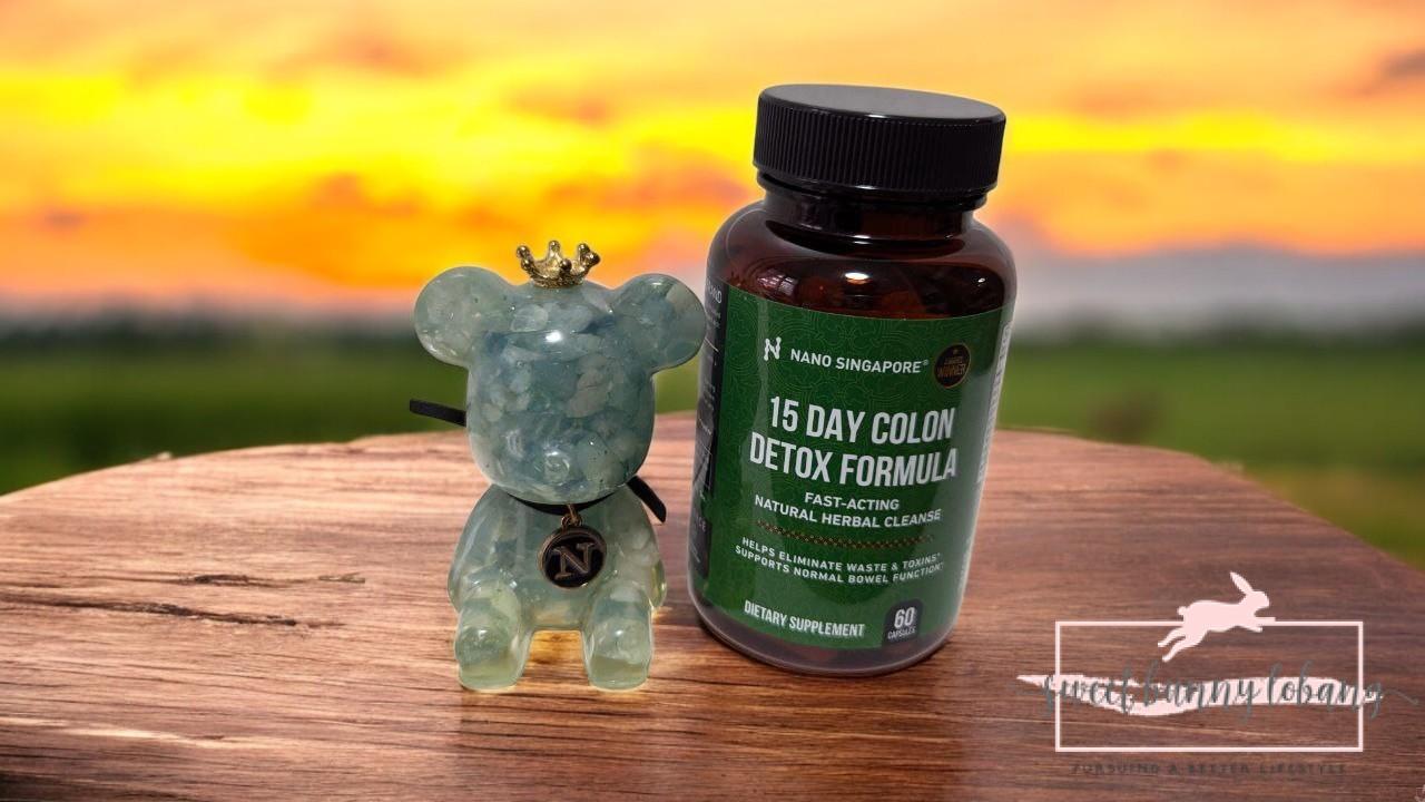 Is a 15-Day Colon Detox the Key to Rejuvenating Your Well-Being?* 1 a bottle of 15 Day Colon Detox Formula next to a small figurine