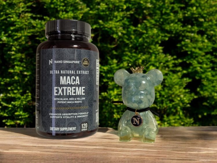 a bottle of Maca Extreme next to a small animal figure